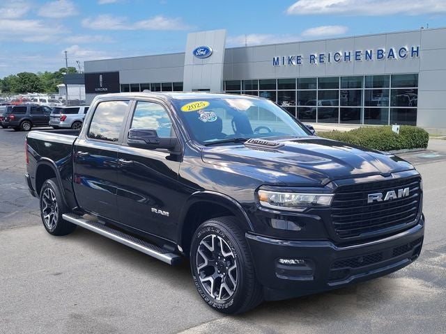 2025 RAM 1500 Laramie in Diamond Black Crystal Pearlcoat — front three-quarter view